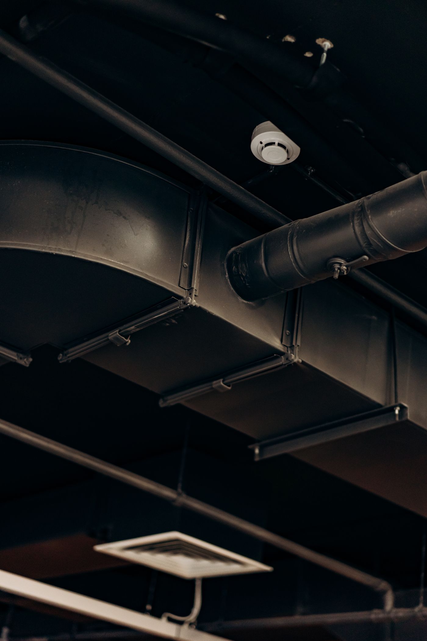 Rectangular sheet-metal HVAC ductwork installed overhead